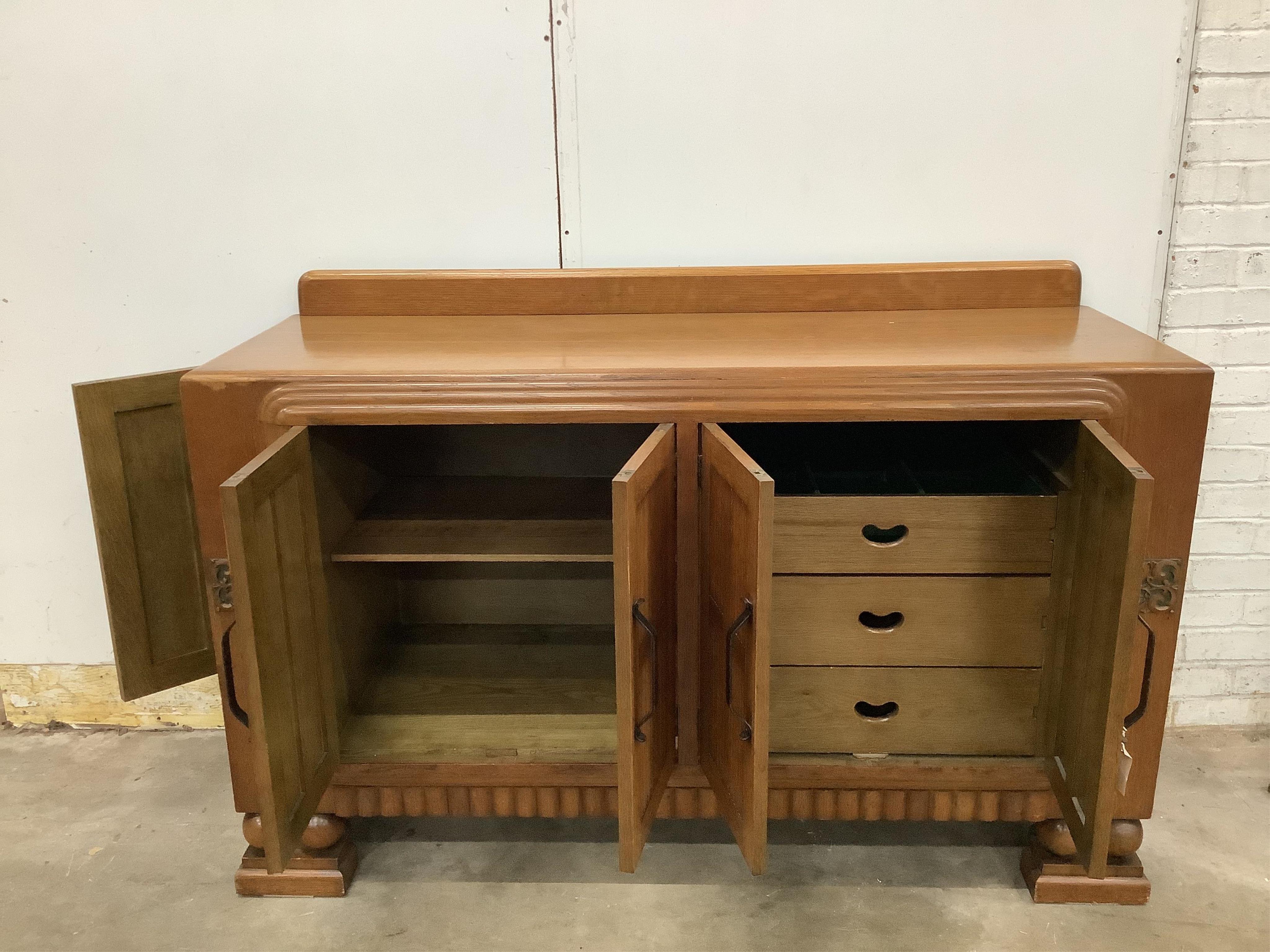 A French Art Deco oak sideboard, width 153cm, depth 52cm, height 99cm. Condition - good